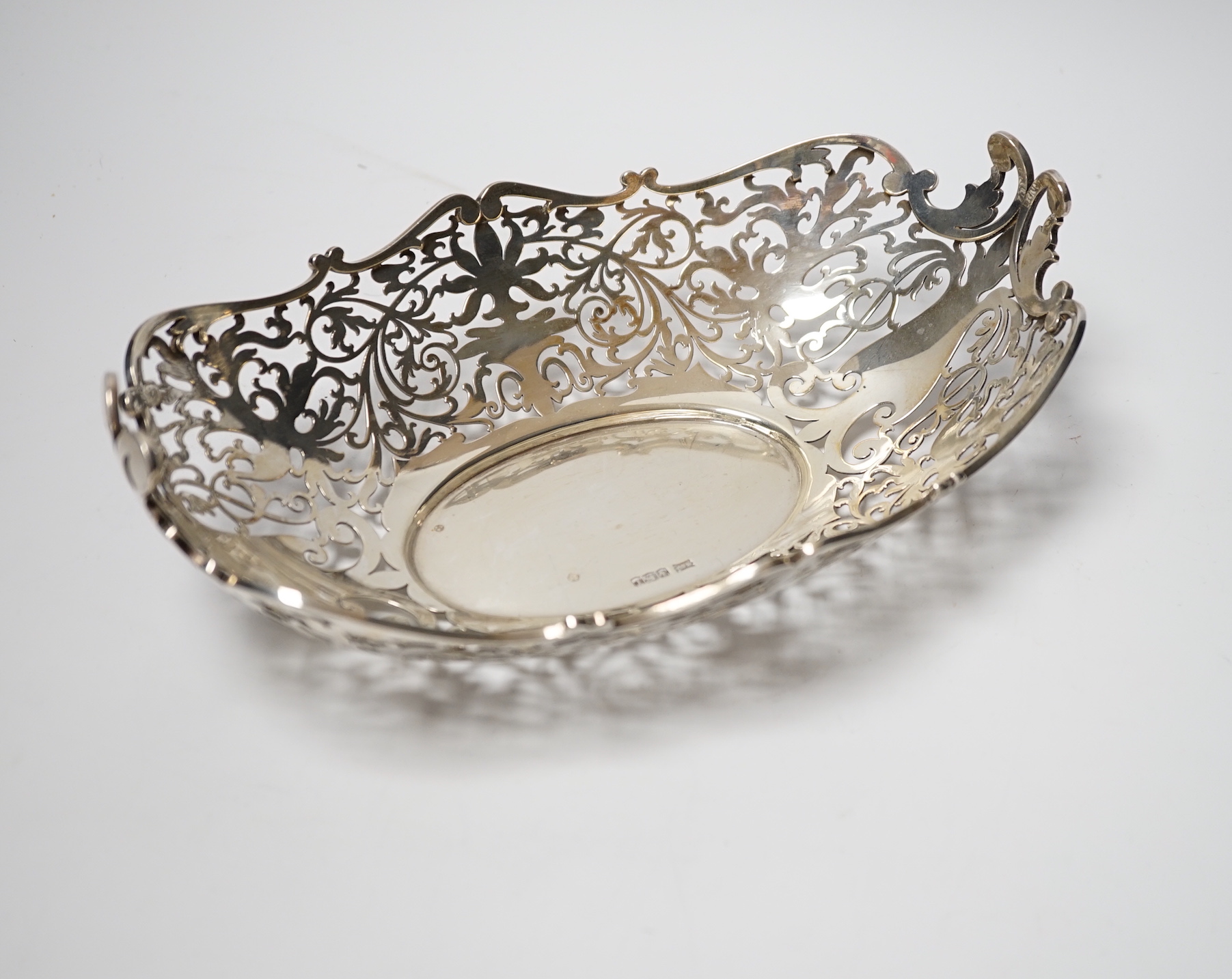 A George V pierced silver oval dish, Walker & Hall, Sheffield, 1928, 25.4cm, 13.4oz